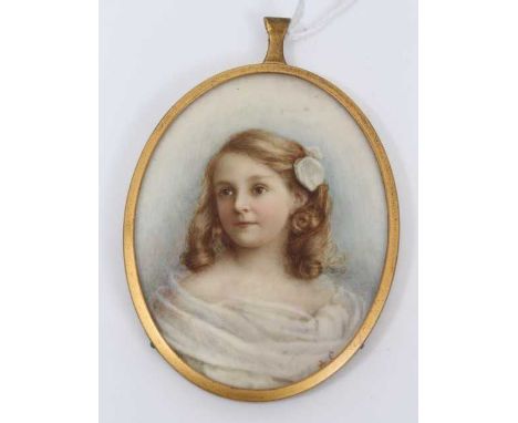 Early 20th century portrait miniature on ivory of a young girl, signed A.C., oval in gilt frame with loop suspension, 9cm hig