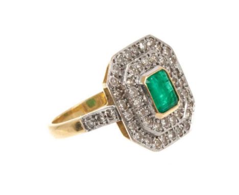 Art Deco emerald and diamond cluster ring with a central rectangular step cut emerald surrounded by an octagonal double borde