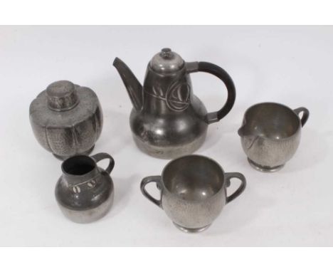 Tudric pewter teapot and ensuite cream jug by Archibald Knox, numbered 0375, the teapot 14cm high, together with hammered pew