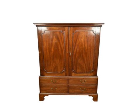 George III mahogany linen press, with concave moulded cornice and interior of slides enclosed by pair of panel doors, the bas