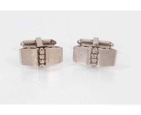 Pair of white gold and diamond cufflinks each panel set with a vertical row of four brilliant cut diamonds Total weight 11.4 