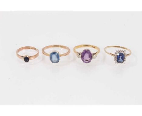 Four gold and gem-set dress rings to include an amethyst and diamond three stone ring (4)Amethyst and diamond ring: 18ct, rin