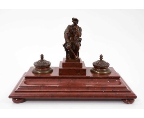 Classical revival bronze and sienna marble ink stand, with ornamental centurion figure flanked by lidded wells housing origin