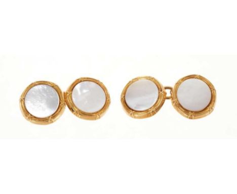 Pair of 18ct gold mother of pearl disc cufflinks (Birmingham 2002)Total weight 14 grams.Diameter of each disc 13mm&nbsp;
