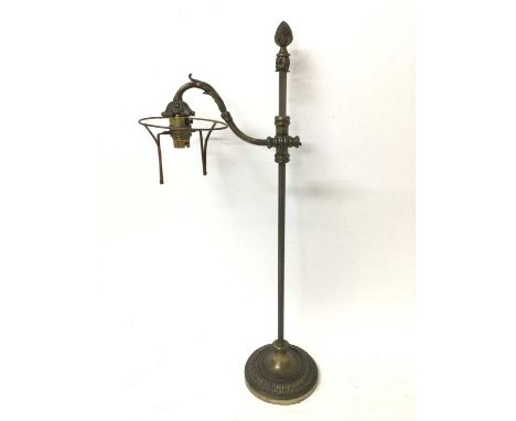 Antique bronze student style desk lamp, with projecting arm, adjusting on fluted column and circular weighted base, 63cm high