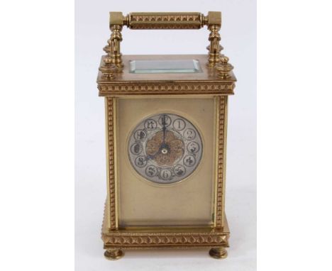 Early 20th century French brass carriage clock with gilt and silvered dial and hobnail decoration 14.5 cm and leather case.