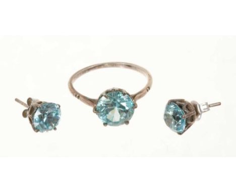 Blue zircon single stone ring with a round mixed cut stone, estimated to weigh approximately 4.29cts, in a six claw setting o