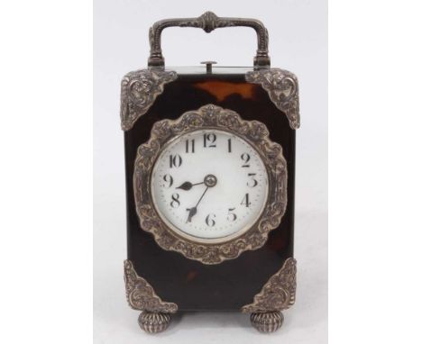 Late Victorian silver mounted tortoiseshell cased carriage clock with repeating movement and circular white enamel dial on fl