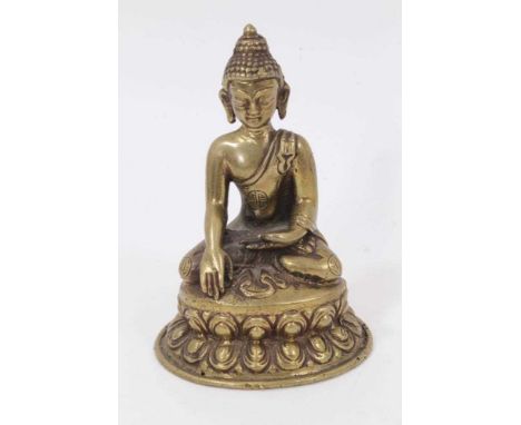Small Tibetan bronze buddha, on spread lotus base, 10.5cm high