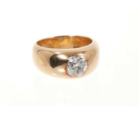 Diamond gypsy ring with an old cut diamond estimated to weigh approximately 1.15cts in rub-over gold gypsy setting on wide go