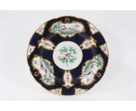A scarce early 19th century copy of a first period Worcester plate, possibly Coalport, with painted bird and insect reserves,