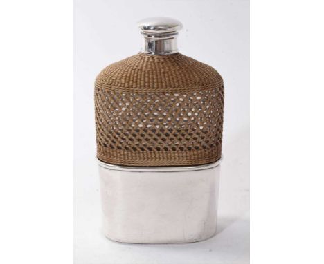 Victorian silver mounted glass hip flask, with rattan cover and silver screw fit top, together with a silver plated detachabl