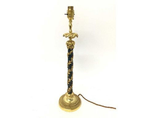 Regency style lamp bronze and ormolu lamp, with slender column applied with spiralling foliate ornament raised on moulded ste