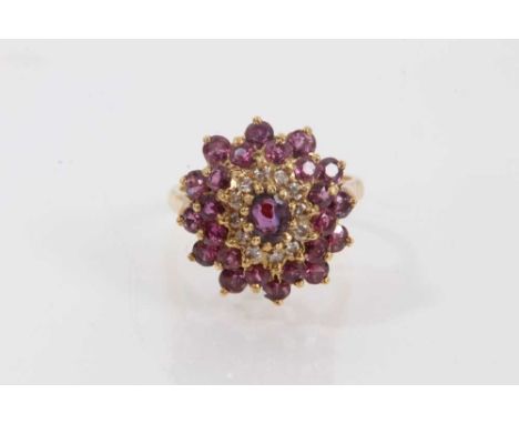 1970s ruby and diamond cluster ring in 18ct gold setting (London 1975). Ring size Q½Weight 7 grams. Good condition commensura