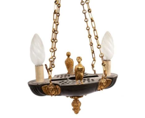 Empire style twin light lantern, in the form of a Classical oil lamp with theatrical mask ornament and sphinx surmounts, susp