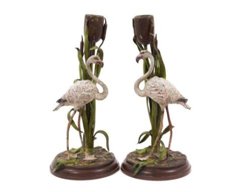 Pair of Austrian cold painted bronze candlesticks, in the form of storks and bulrushes, on circular plinth bases, 23cm high