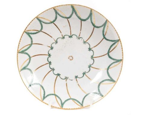 A Bristol saucer dish, circa 1775, decorated in green and gilt with swags, crossed swords mark and gilt number 3 to base, 18.