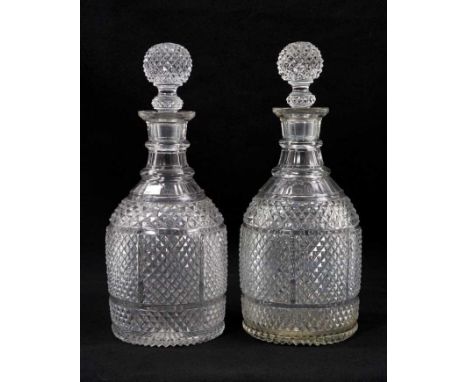 A pair of 19th century ovoid-form two-ring diamond-cut glass decanters with globe stoppers, 28cm highNumerous small chips, fl