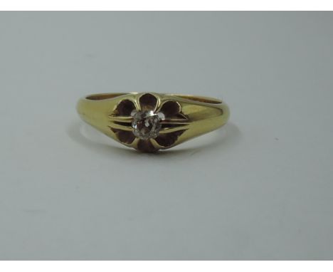 An 18ct gold signet ring having an old cut diamond, approx 0.25ct in a star burst setting, size S &amp; approx 5.5g