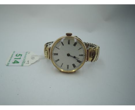 A converted yellow metal top wound pocket watch stamped 14K having Roman numeral dial to damaged enamel face in engraved case