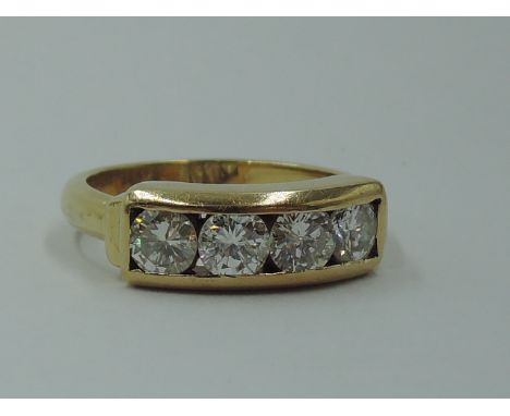 A four stone diamond dress ring, total approx 1ct in a parallel collared mount on an 18ct gold loop, size N &amp; approx 6.1g