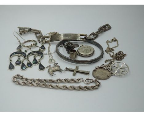 A small selection of HM silver and white metal including rope chain bracelet, identity bracelet, narrow hinged bangle, etc