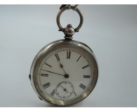 A continental silver key wound pocket watch having Roman numeral dial with subsidiary seconds on a white enamel dial in an en