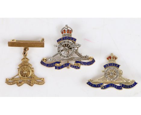 Three Royal Artillery gold brooches, the first in 9 carat gold with enamel and diamonds to the cannon wheel and carriage, 35m