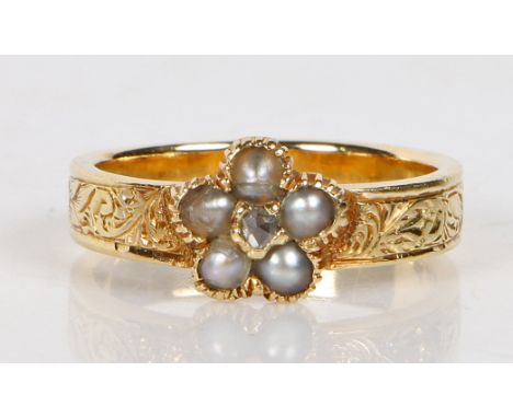 A 19th Century diamond, pearl and yellow metal mourning ring, the central rose cut diamond surrounded by five pearls, on a fo