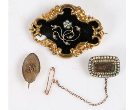 A Victorian yellow metal, black enamel and pearl mourning brooch, the pearl set foliate centre on a black enamel ground and s