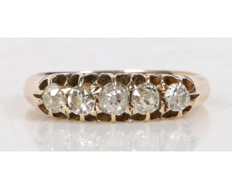 An 18 carat gold ring set with five graduated diamonds, the central stone measuring 3.4mm diameter, the outer stones measurin