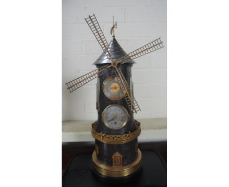 A good quality novelty windmill clock/barometer over a clock and thermometer - both sides on a stepped brickwork base and und