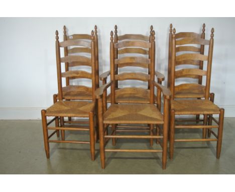 A set of six, 4 + 2, ladder back dining chairs with rush seats