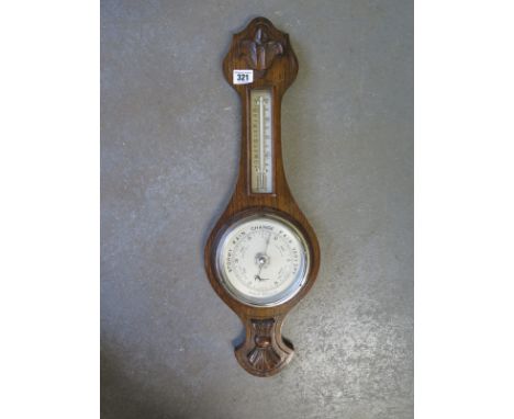 An oak aneroid barometer with thermometer - Height 58cm