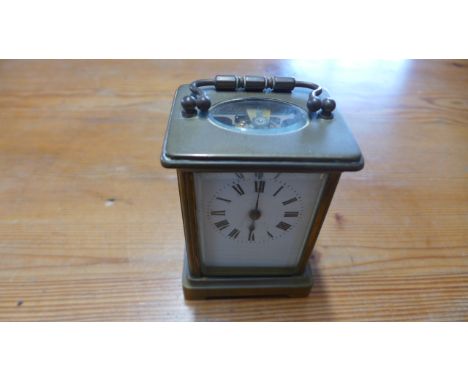 A brass and five glass carriage clock, Roman numerals to white enamel dial - not working 