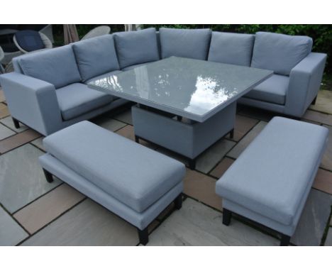 A Bramblecrest all weather Indigo curved modular sofa with square adjustable casual dining table and two benches in light gre