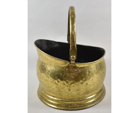 A Brass Helmet Shaped Coal Scuttle 