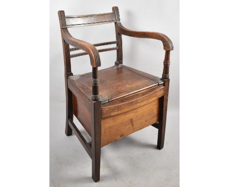 An Edwardian Commode Armchair 
