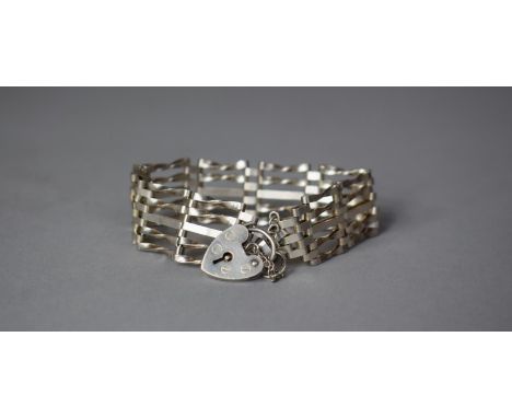 A Silver Gate Bracelet with Hallmarked Silver Locket and Safety Chain, London 1979 