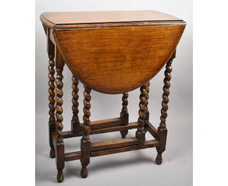 An Edwardian Oak Barley Twist Gate Legged Oval Topped Table, 60cm wide 