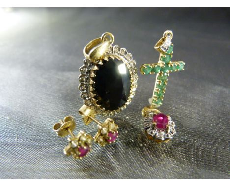 Three 9ct Gold Gemset pendants. Small ruby and Diamond cluster pendant with matching earrings, Emerald set cross and a Oval p