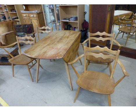 A set of four retro very rare Ercol 493 Windsor Carver Chairs. Only in production for three years from 1964-1967, chairs cons