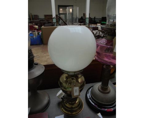 Converted electric brass oil lamp with domed clouded glass shade