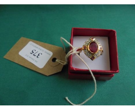 Ruby and zircon Art Deco style yellow metal ring (Size V/W) 