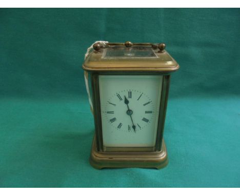 Brass carriage clock, the enamel dial inset roman numerals