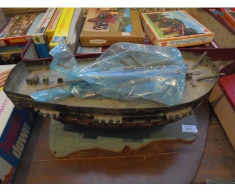 Early 20th century model of Tug boat with sales on wooden plinth