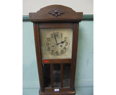 Oak cased wall clock with steel dial and brass pendulum