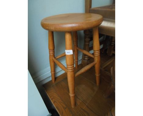 Light oak stool with circular dish seat