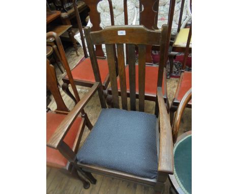 Oak framed armchair with four vertical splats to back, the padded seat upholstered in light blue patterned contemporary cloth