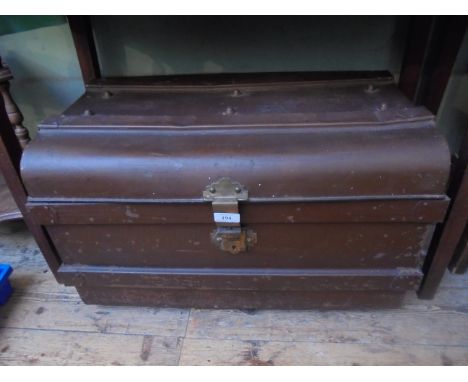 Battened brown painted tin travelling trunk with brass lock